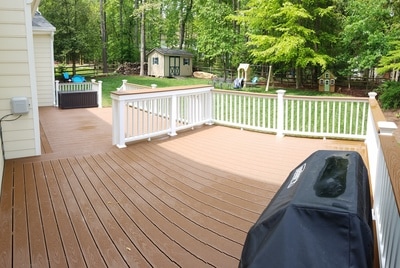multi-level trex deck with custom bar top, and white railings